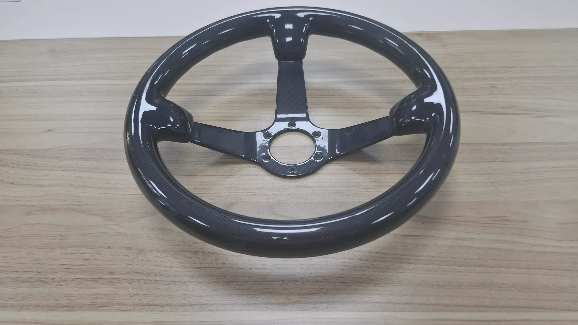 Carbon fiber racing steering wheel manufactured for motorsport use