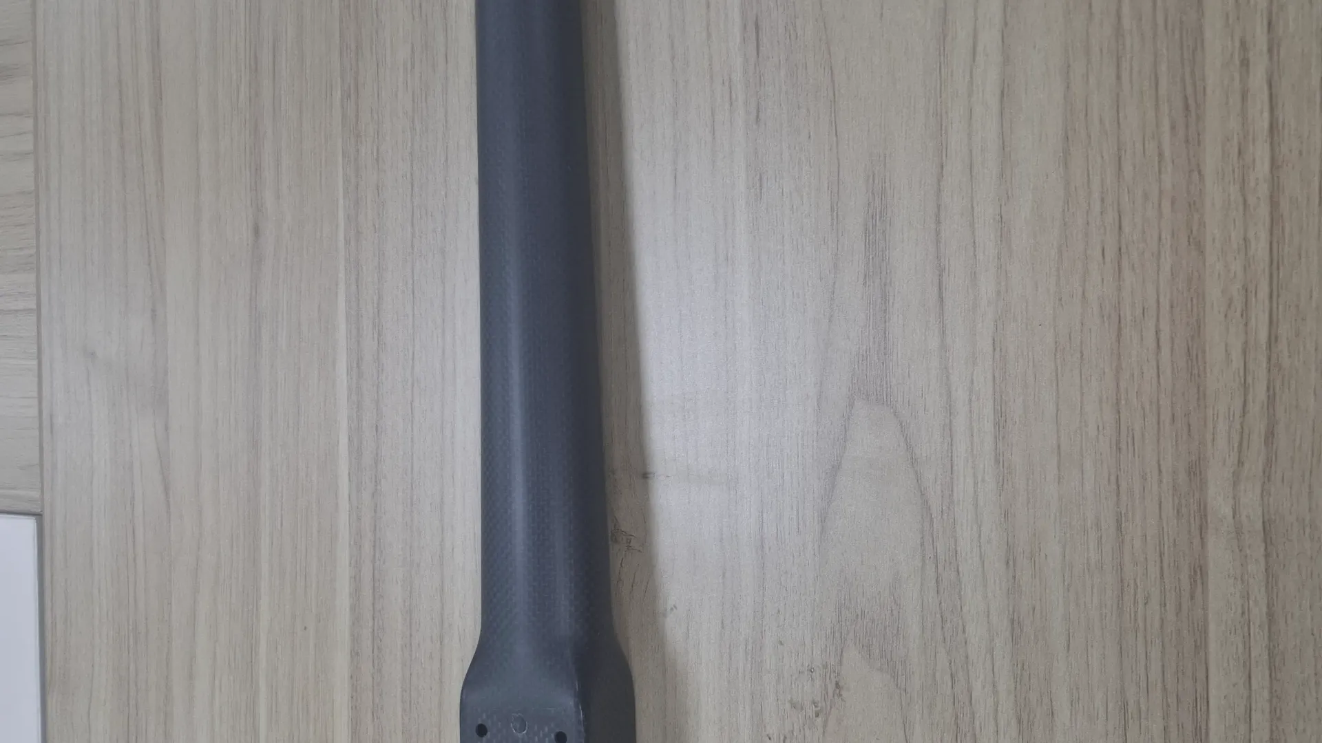Carbon fiber tube with an integrally moulded mounting foot used in UAV arm structures